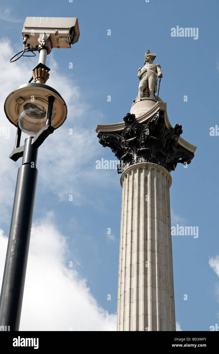Big Brother is watching!  A CCTV video camera looking Lord Nelson in the eye (Nelsons Column) in Trafalgar Square, London, UK. Stock Photo