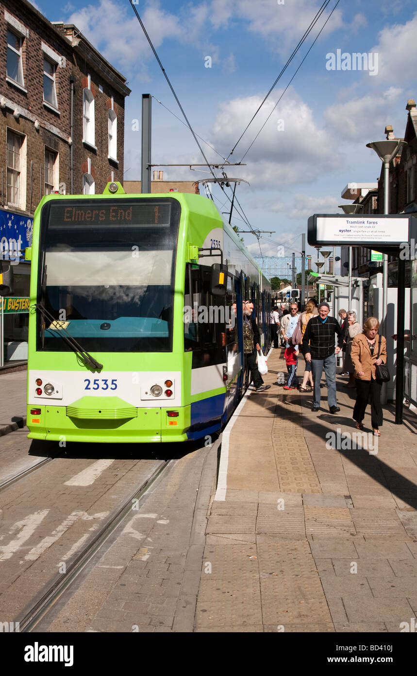 Passengers alighting from the Croydon tram in centre of town Stock Photo