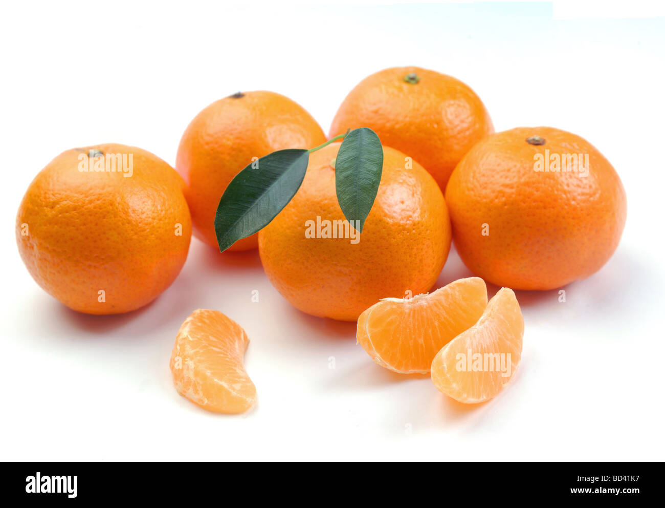 clementines with segments on a white background Stock Photo Alamy