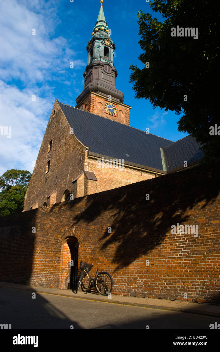 Bicycle parked in front of St Petri church in central Copenhagen Denmark Europe Stock Photo