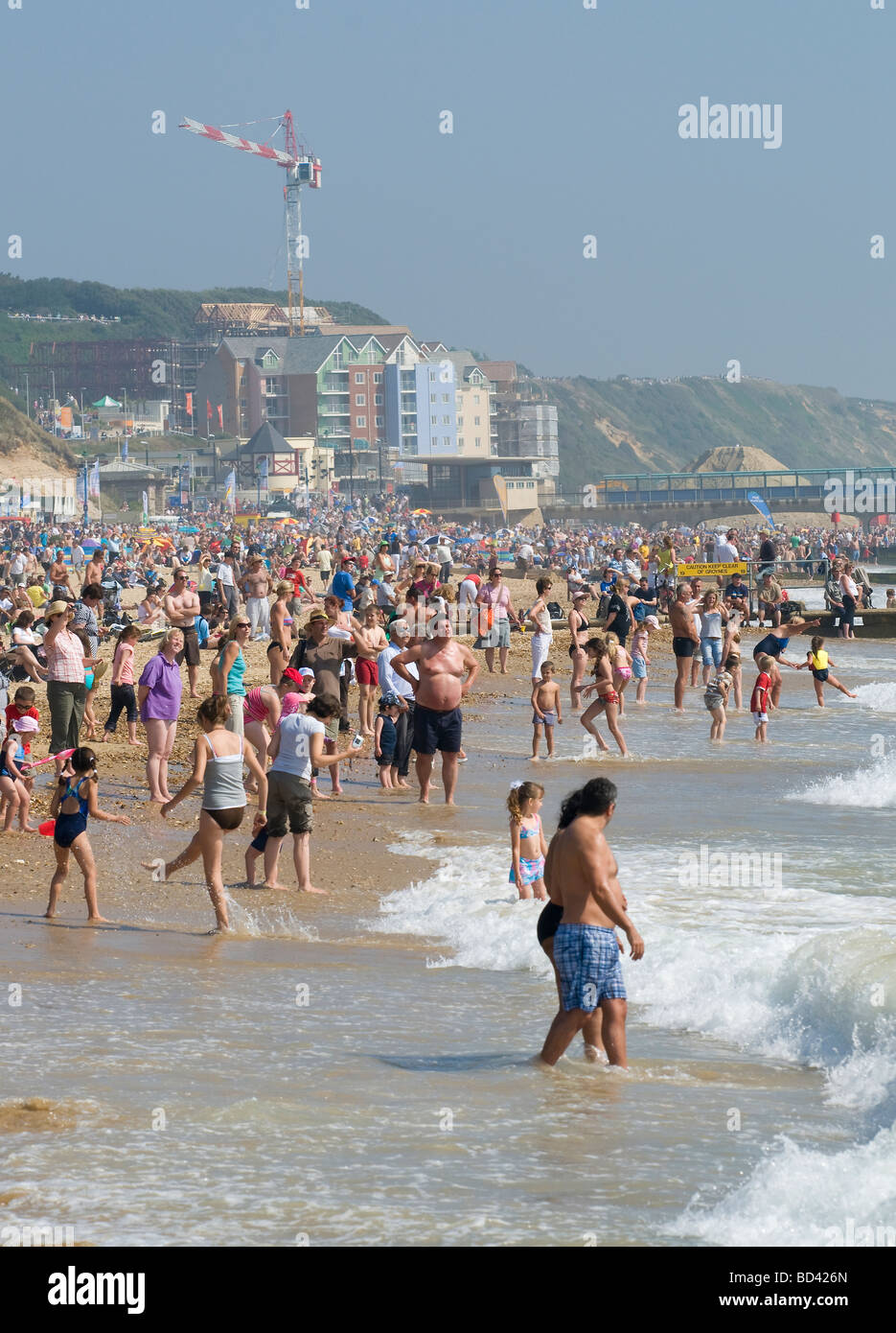 People on Bournemouth and Boscombe beach enjoying the short lived hot summer of 2009 Stock Photo