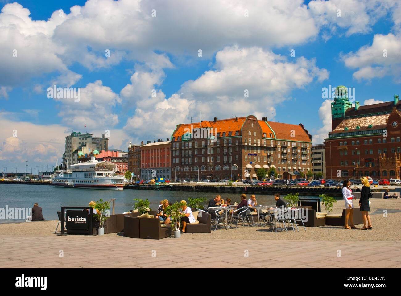 People on cafe terrace at Bagersplats squre at Inre hamnen harbour in Malmö Skåne Sweden Europe Stock Photo