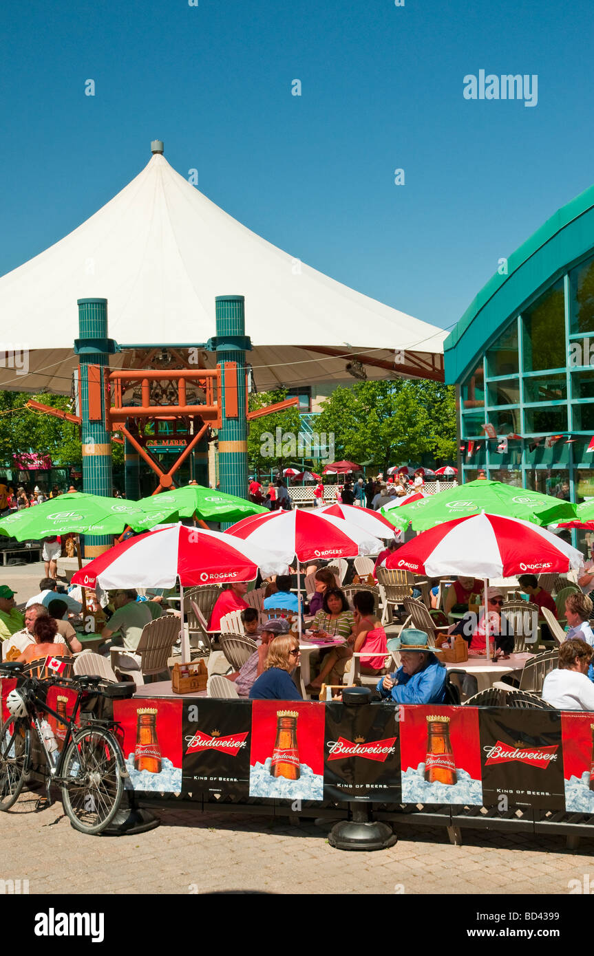 People eating at an outdoor restaurant at The Forks in Winnipeg