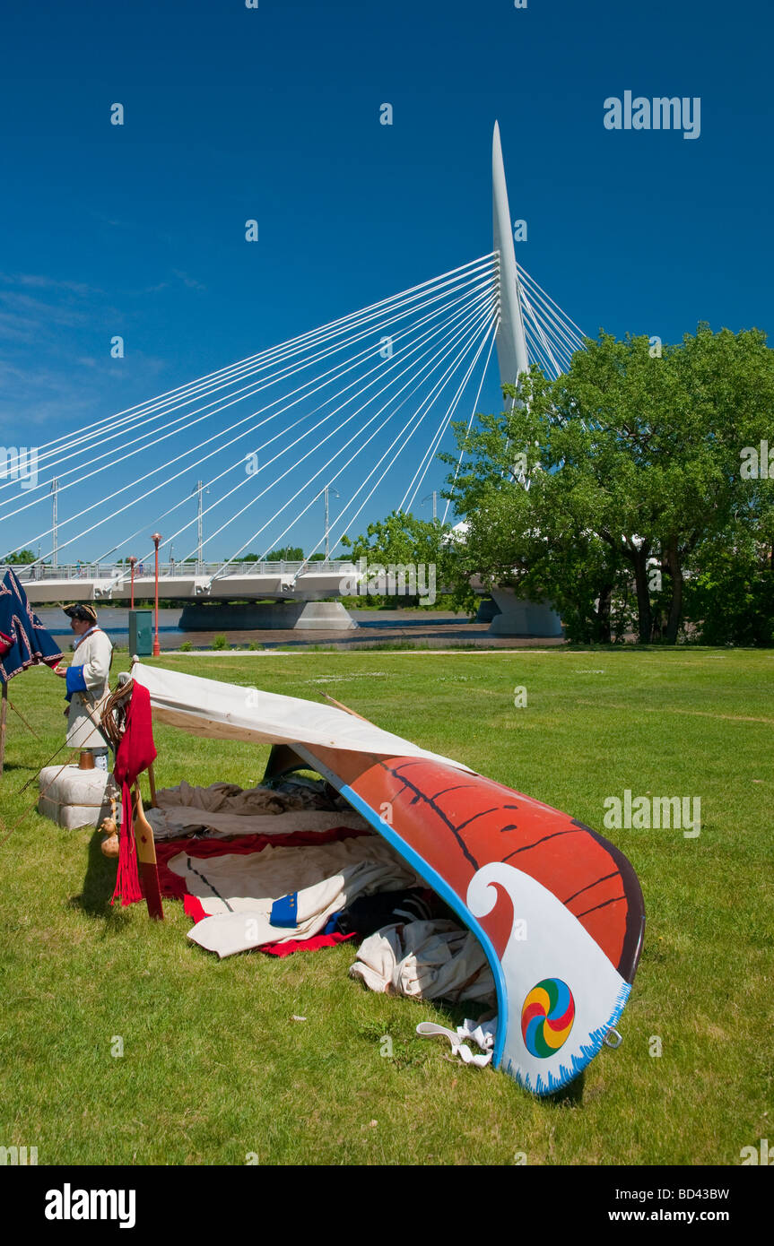 A Red River Canoe and the Provencher Bridge in Winnipeg, Manitoba, Canada Stock Photo