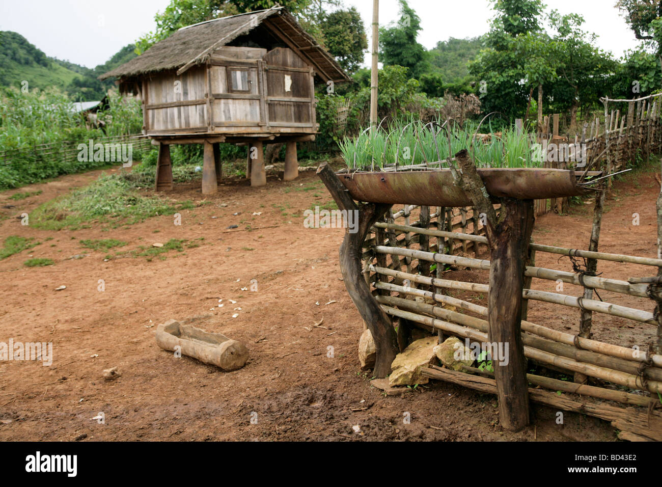 Xieng Khouang, Laos, 2006 : This house sits on stilts made from US cluster bomb casings dropped during the Vietnam War Stock Photo