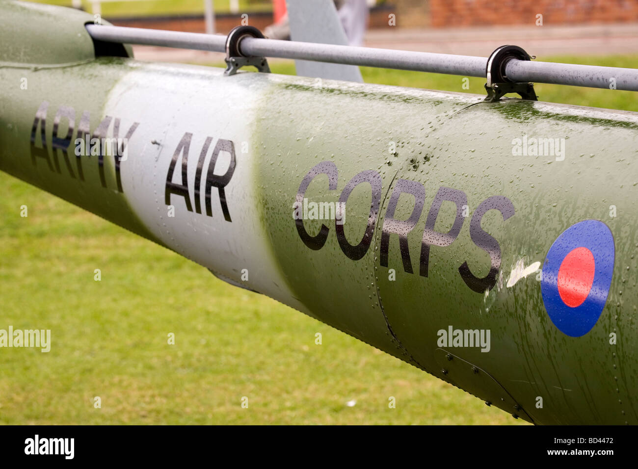 The tail of a British Army Air Corps helicopter. The helicopter is camouflaged in grey and green. Stock Photo