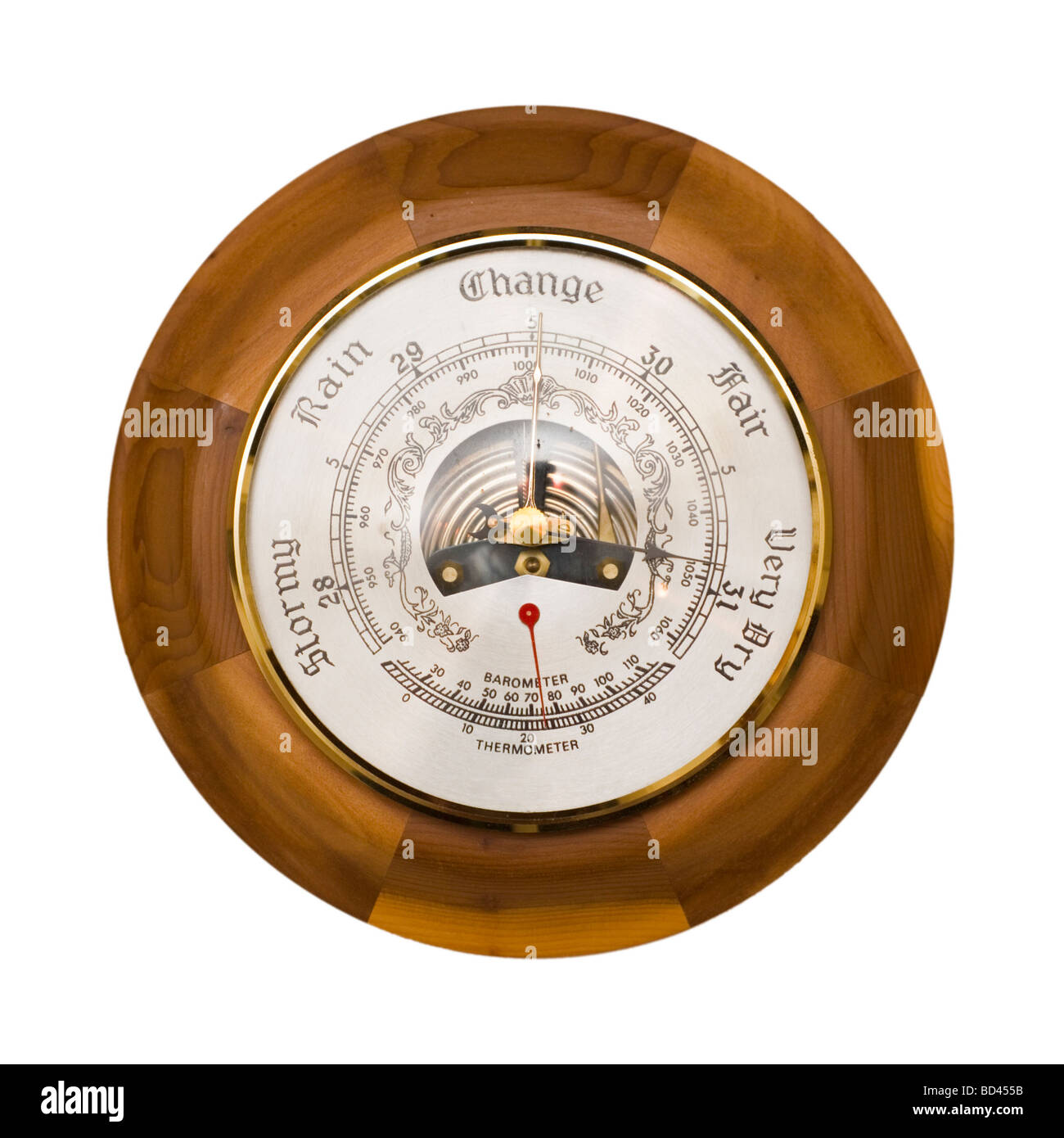 Traditional wooden barometer and thermometer isolated on a white