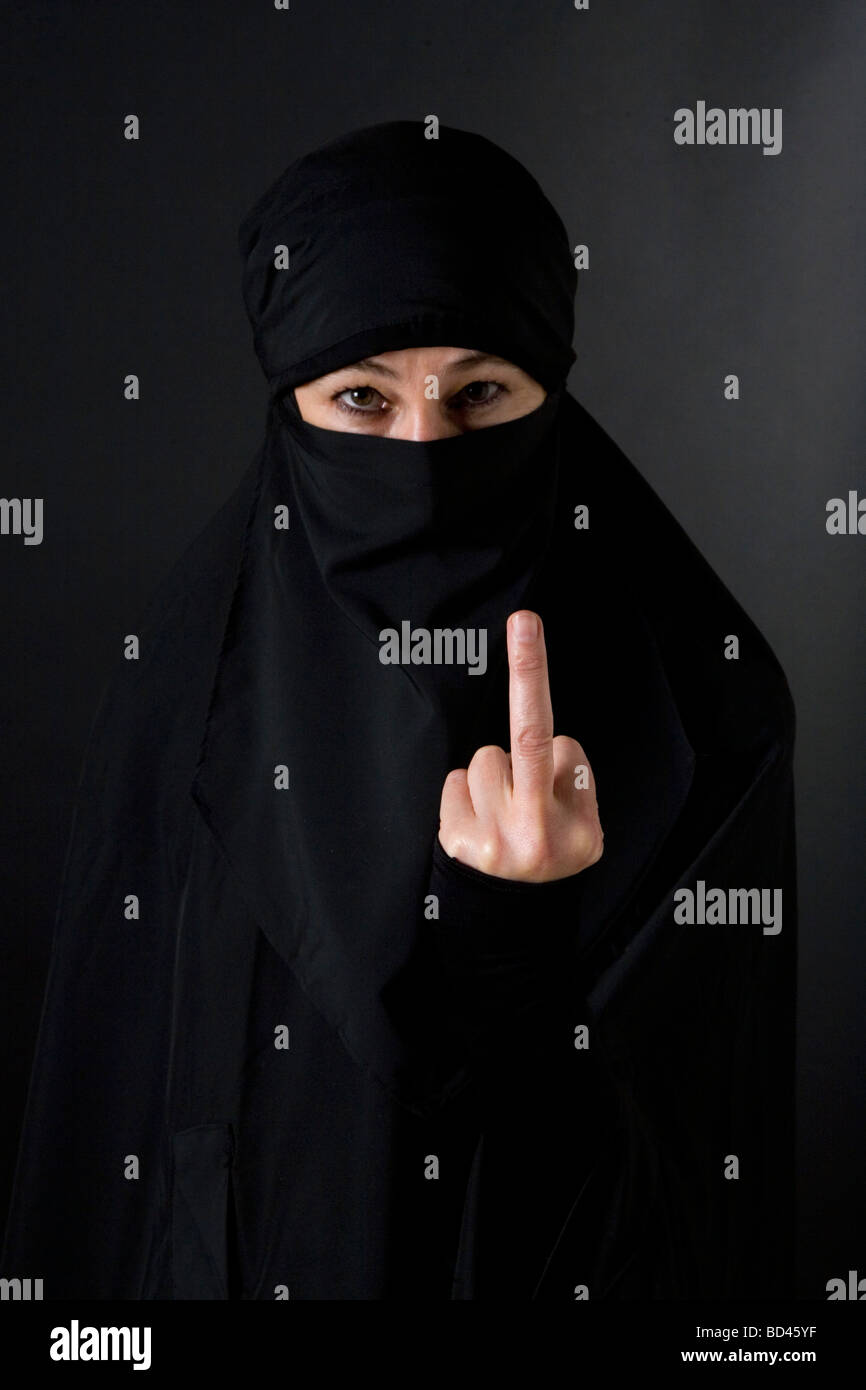 Islamic muslim woman wearing a burqa niqab burka and making a v sign Stock Photo