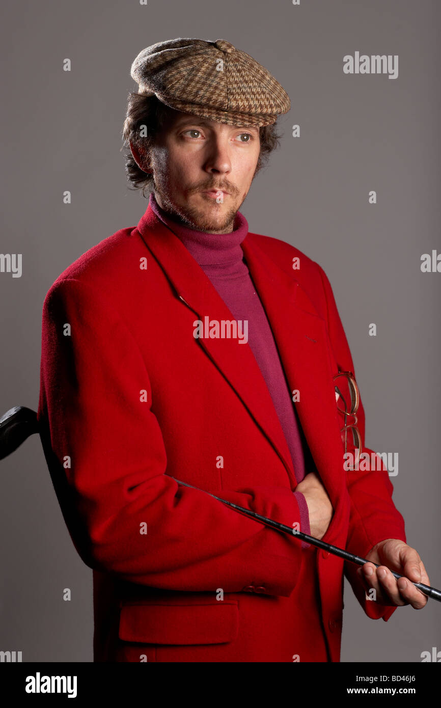 Man wearing lurid golfing clothes photographed in a studio setting Stock Photo