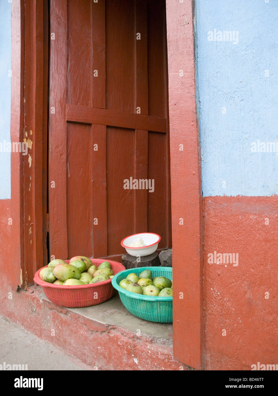 Veggies for sale in doorway in Santiago Atitlan Solola Guatemala Stock