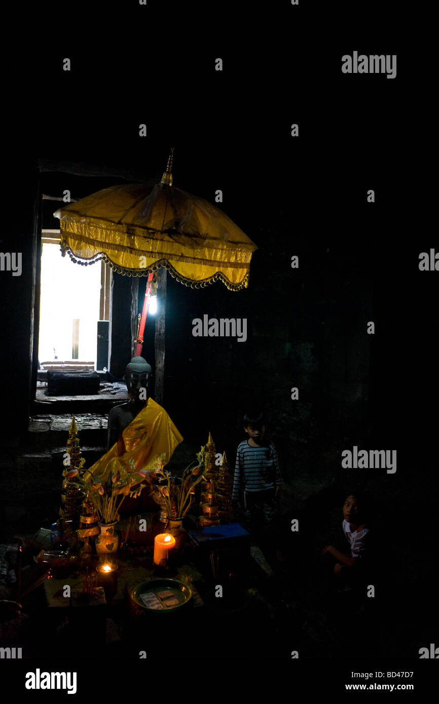 A Buddha statue in the Bayon temple of Angkor Thom Siem Reap Stock Photo