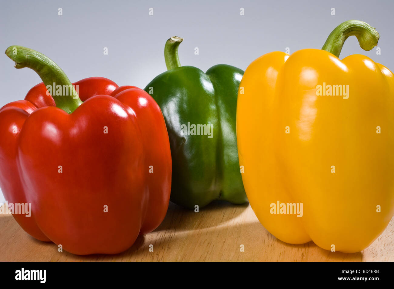 Red green and yellow peppers Stock Photo - Alamy