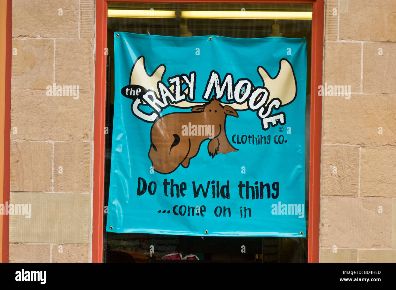 Crazy Moose clothings shop sign in Halifax, Nova Scotia, Canada. Blue banner with moose logo and 'Do the Wild Thing come on in' text. Stock Photo