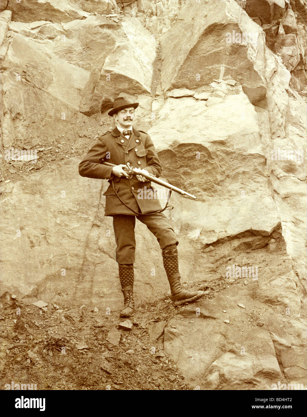 Fashionably Attired Hunter in the Mountains Stock Photo