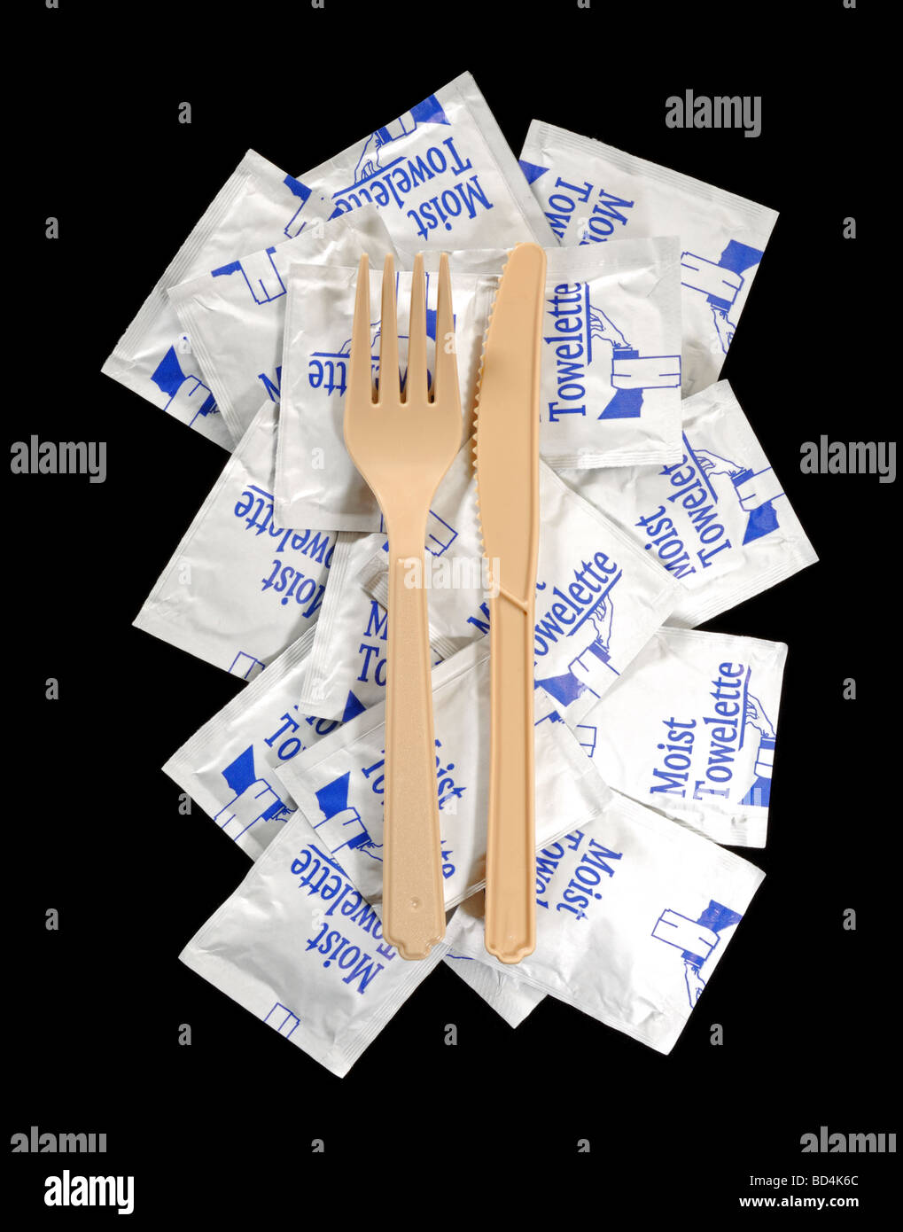 Many moist towelettes with a plastic knife and fork Stock Photo