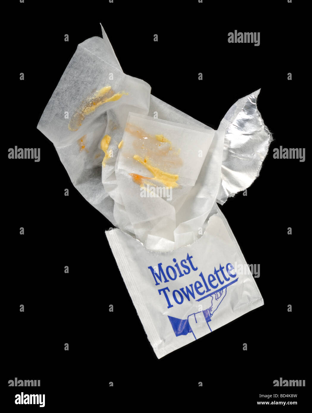A moist towelette with a mustard food stains Stock Photo