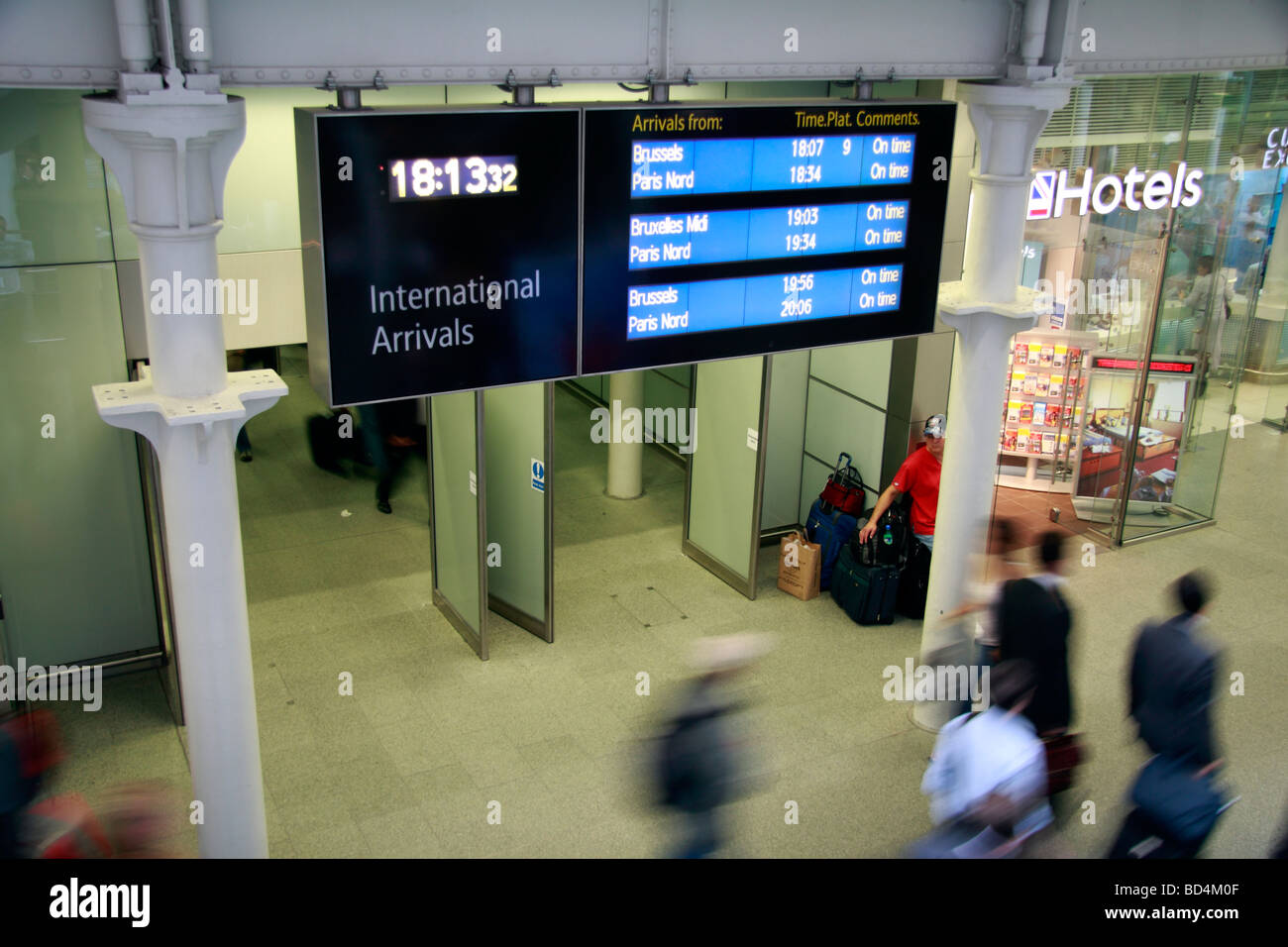 Passengers exit the International arrivals area of the Eurostar terminal, St Pancras International Railway Station, London, UK. Stock Photo
