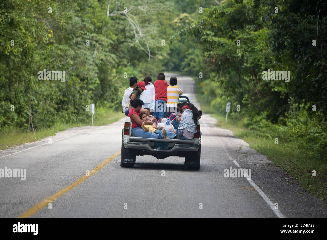 Pickup truck packed with passengers, Guatemala Stock Photo