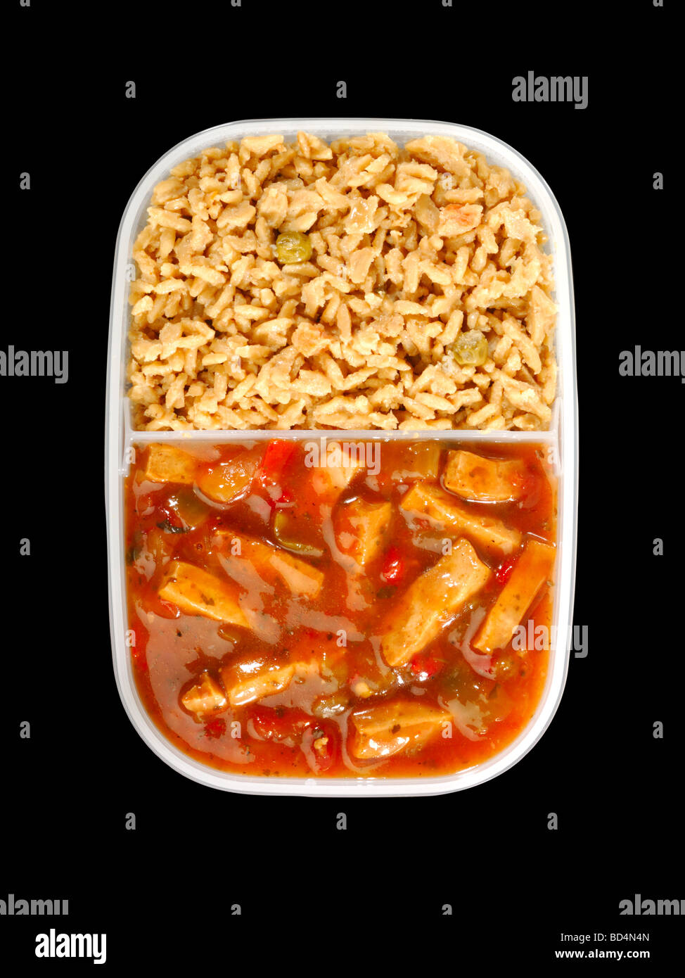 A plastic container with military food rations, chicken in spicy sauce with fried rice Stock Photo