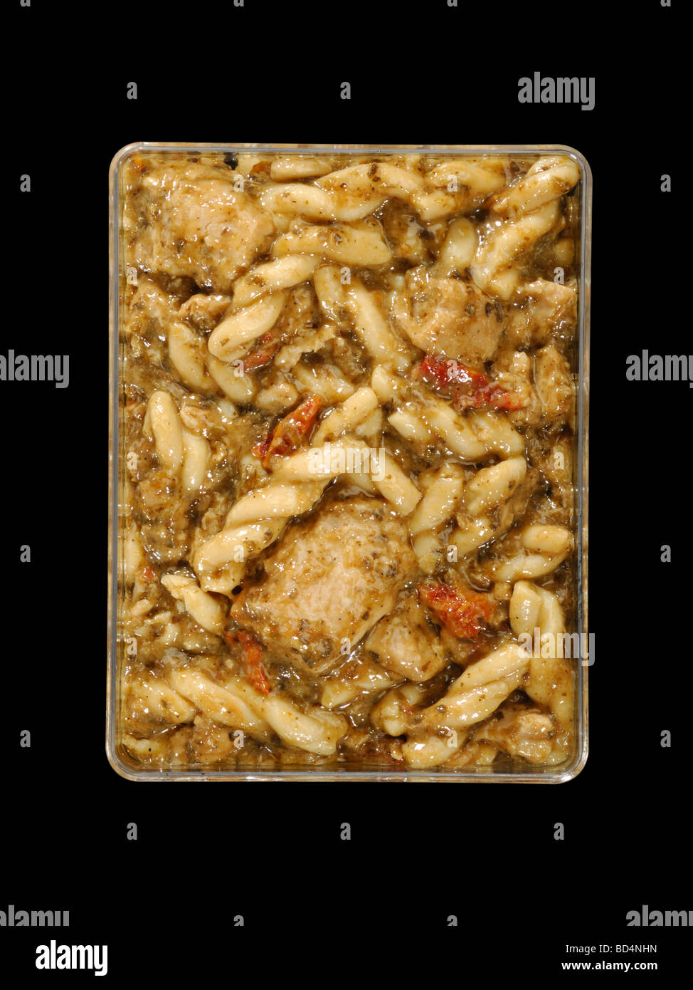 A plastic container with military food rations, pesto pasta chicken Stock Photo