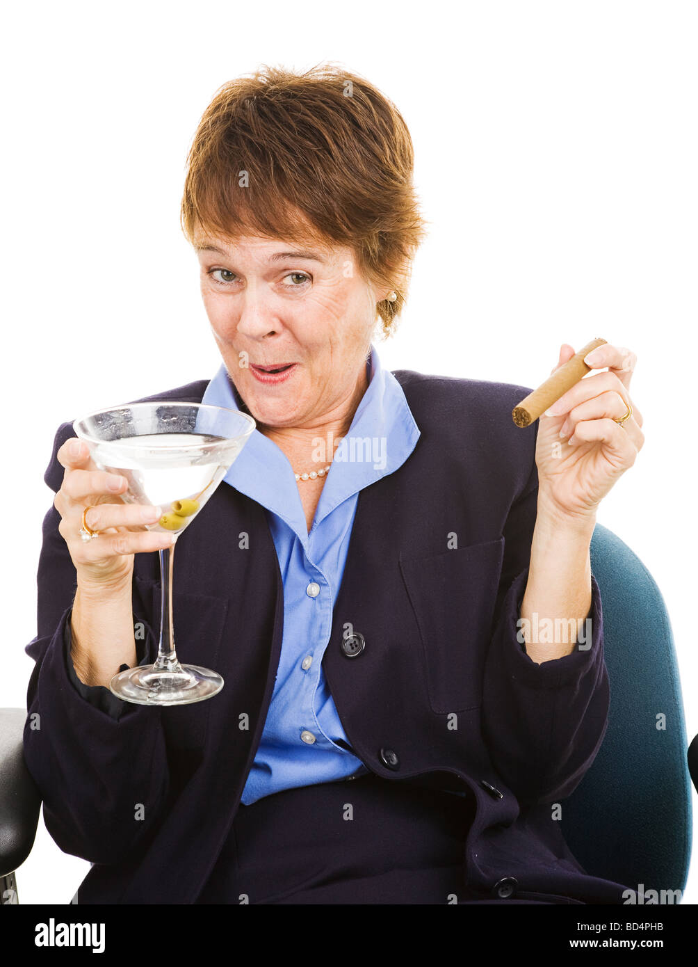 Businesswoman getting drunk at work on a martini while smoking a cigar ...