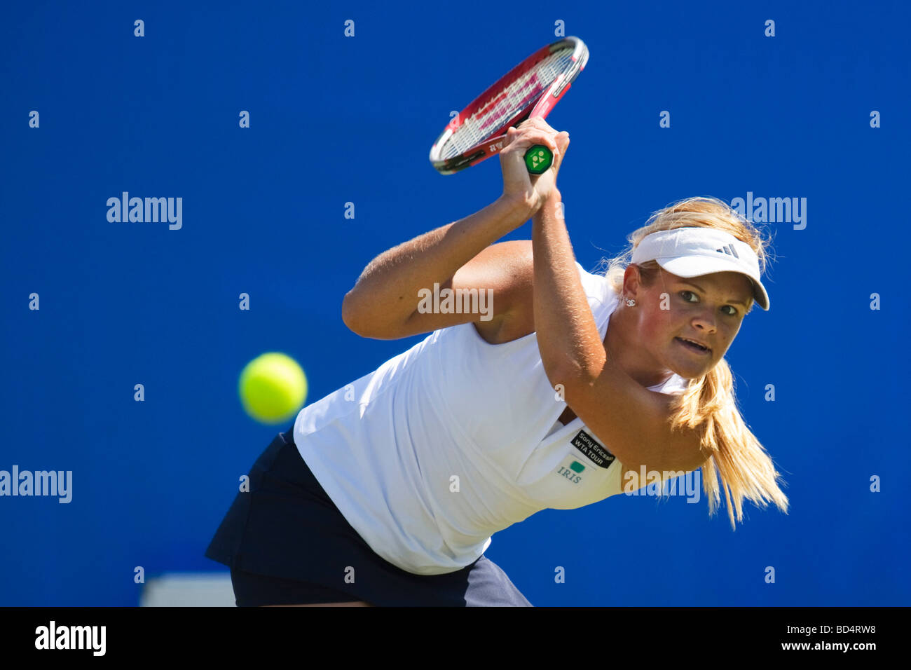 Aleksandra Wozniak in action playing double handed back hand during match. Stock Photo