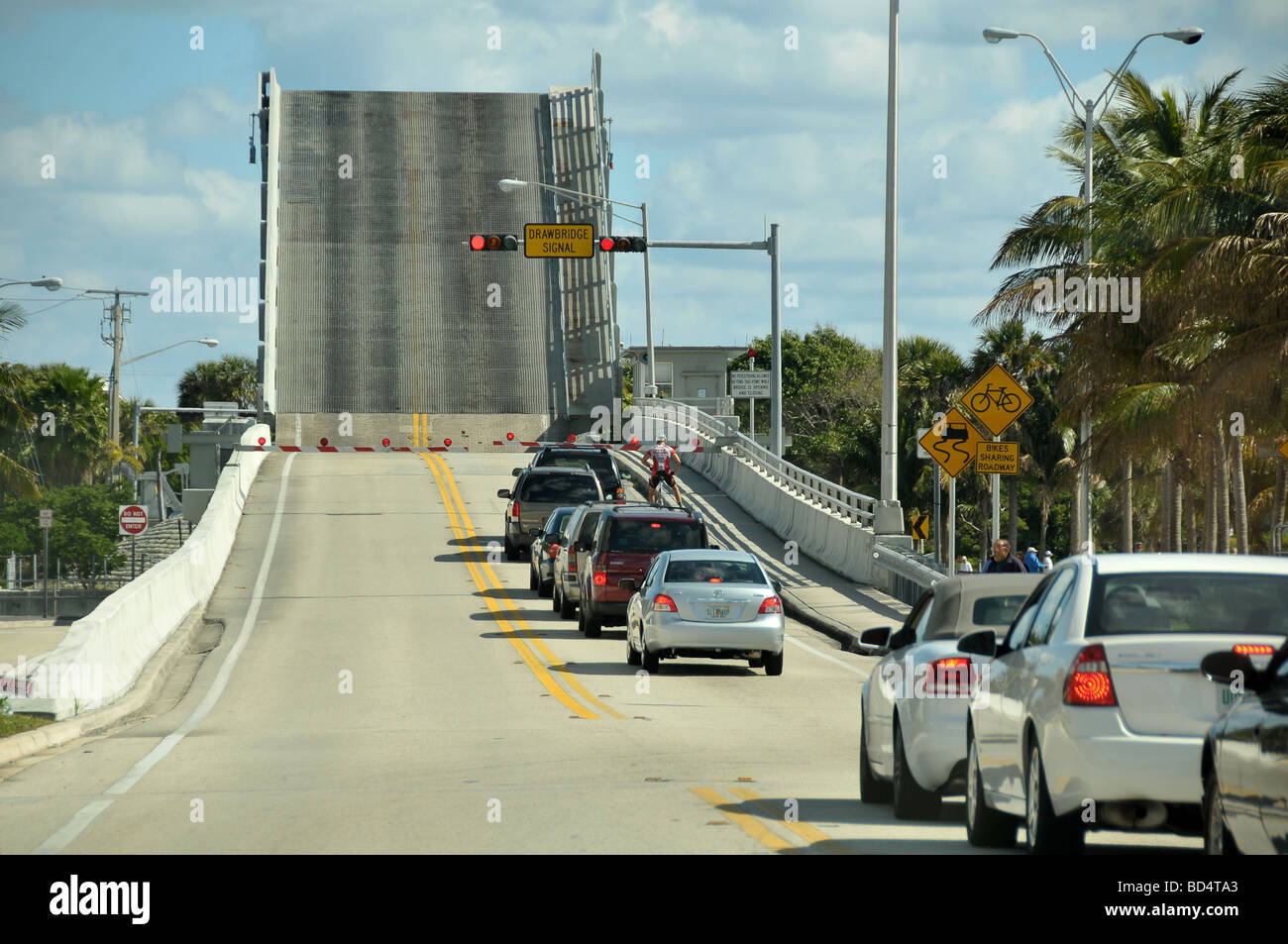 Cars waiting for lift bridge to lower, Florida USA. Stock Photo