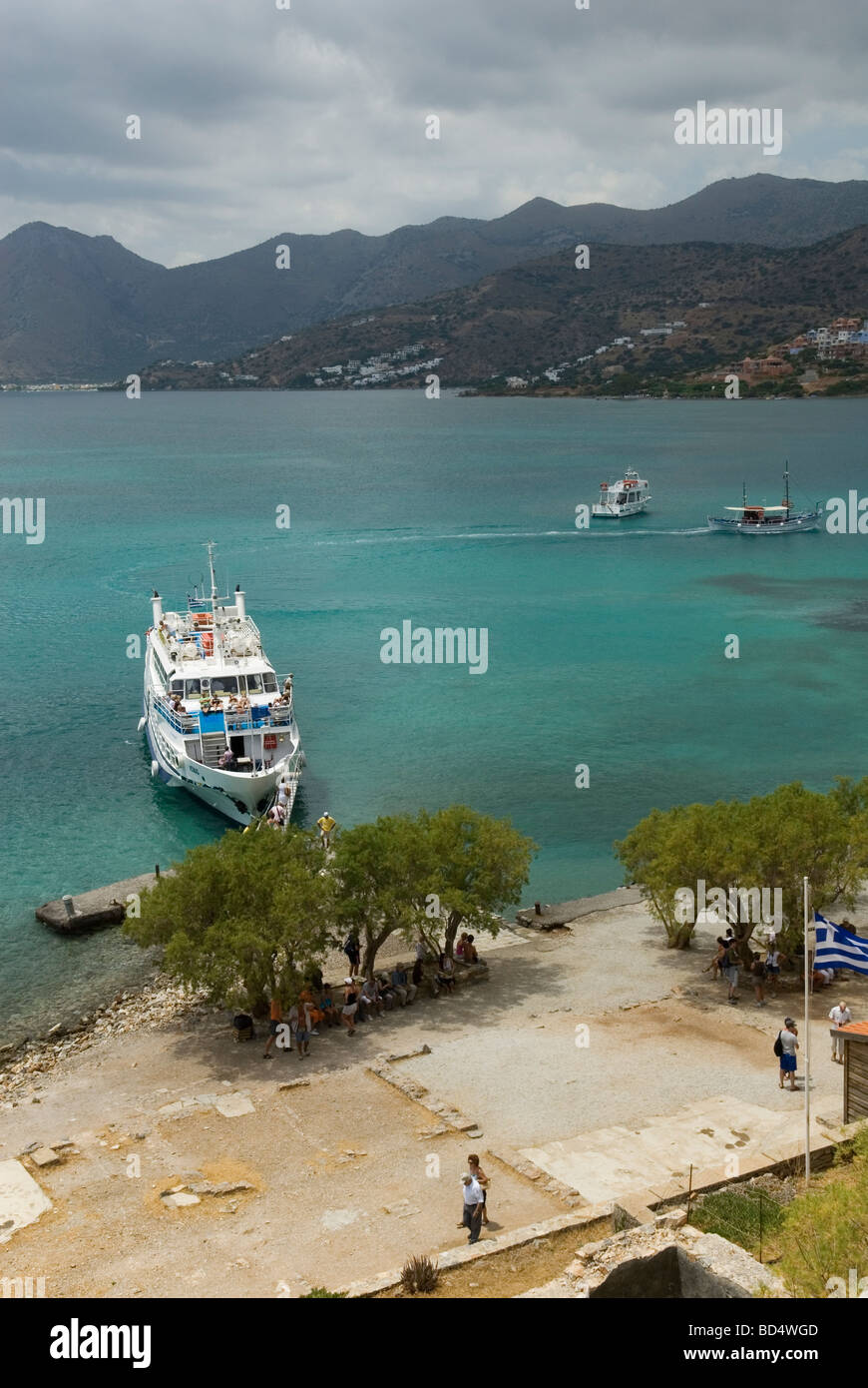 Boats carrying tourists to Spinalonga from Plaka and Elounda Crete Stock Photo