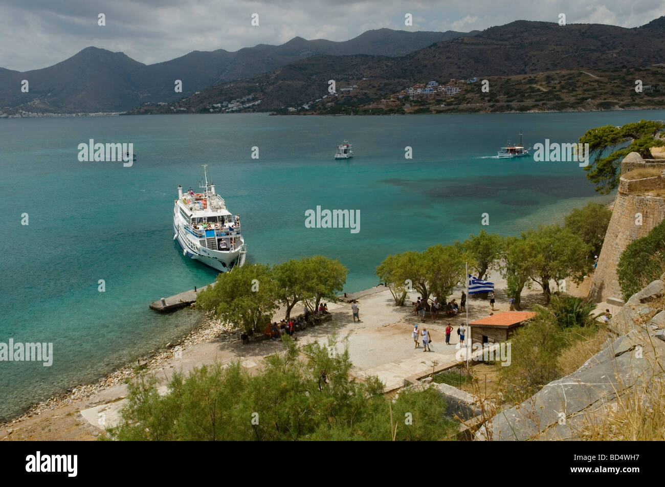 Boats carrying tourists to Spinalonga from Plaka and Elounda Crete Stock Photo