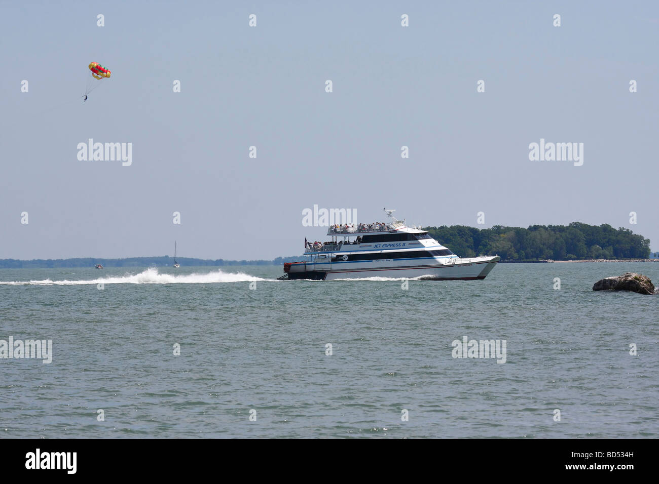 Parasailing with a boat on Lake Erie island  Put in Bay in Ohio USA US lifestyle daily life scenes concept about life events horizontal hi-res Stock Photo