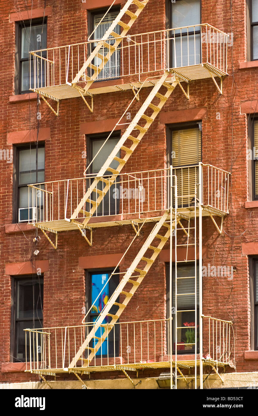 House with metal fire escape stairs ladders hi-res stock