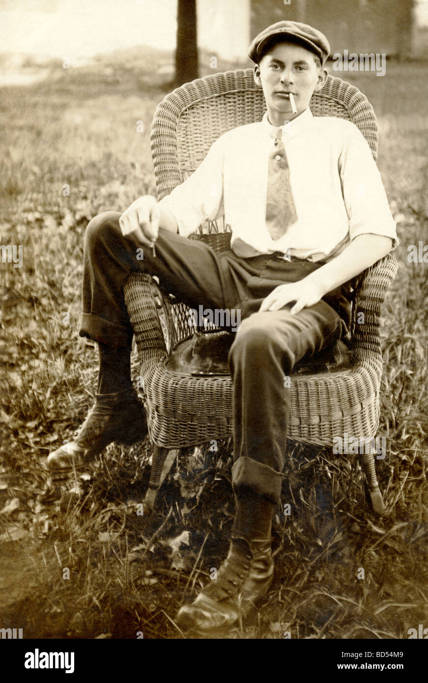 Surly Teenager Lighting a Cigarette Stock Photo
