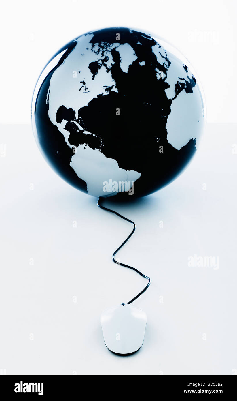 A globe with a computer mouse Stock Photo