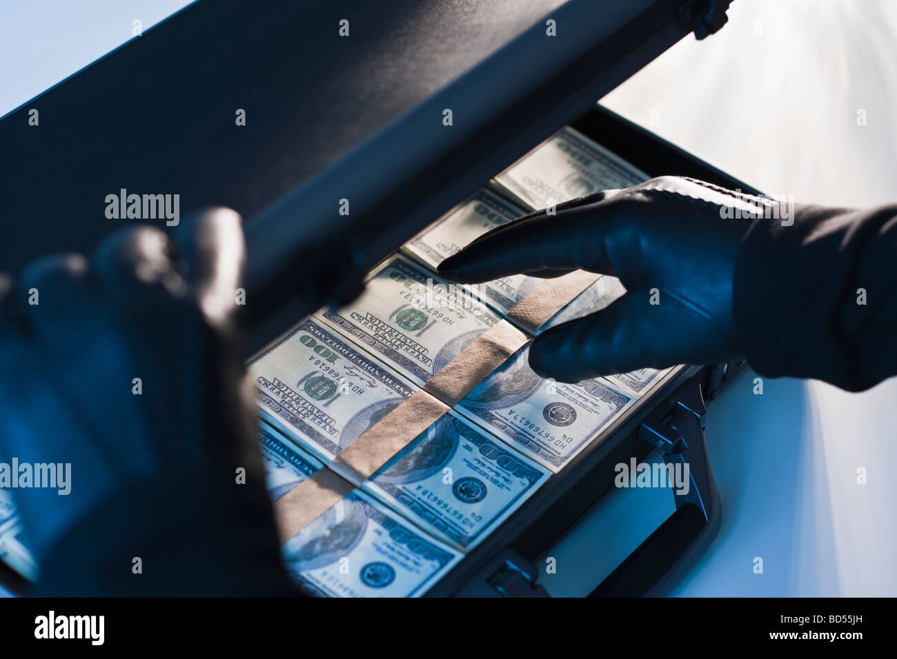 Money in briefcase gloved hands hires stock photography and images Alamy