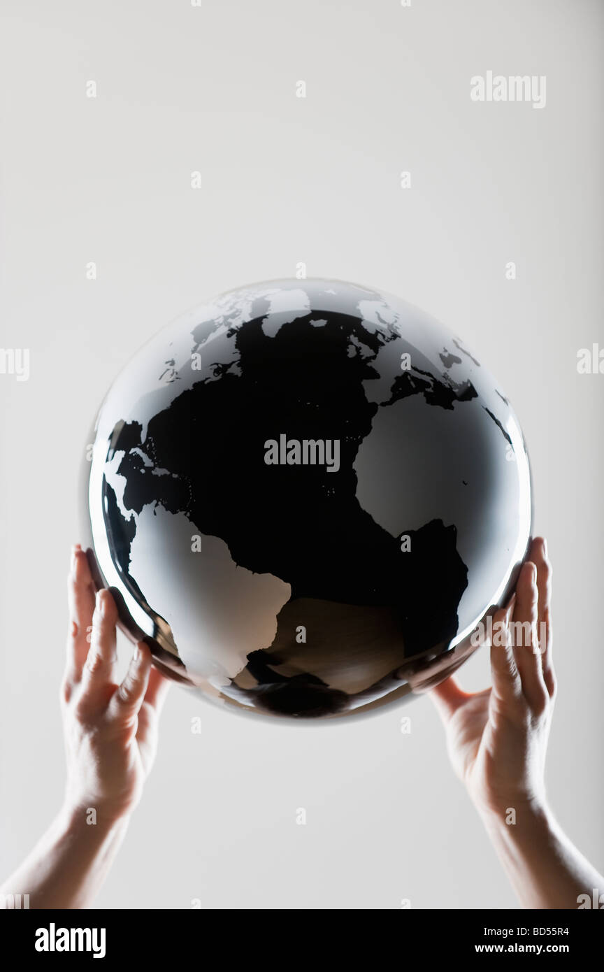 Hands holding a globe Stock Photo