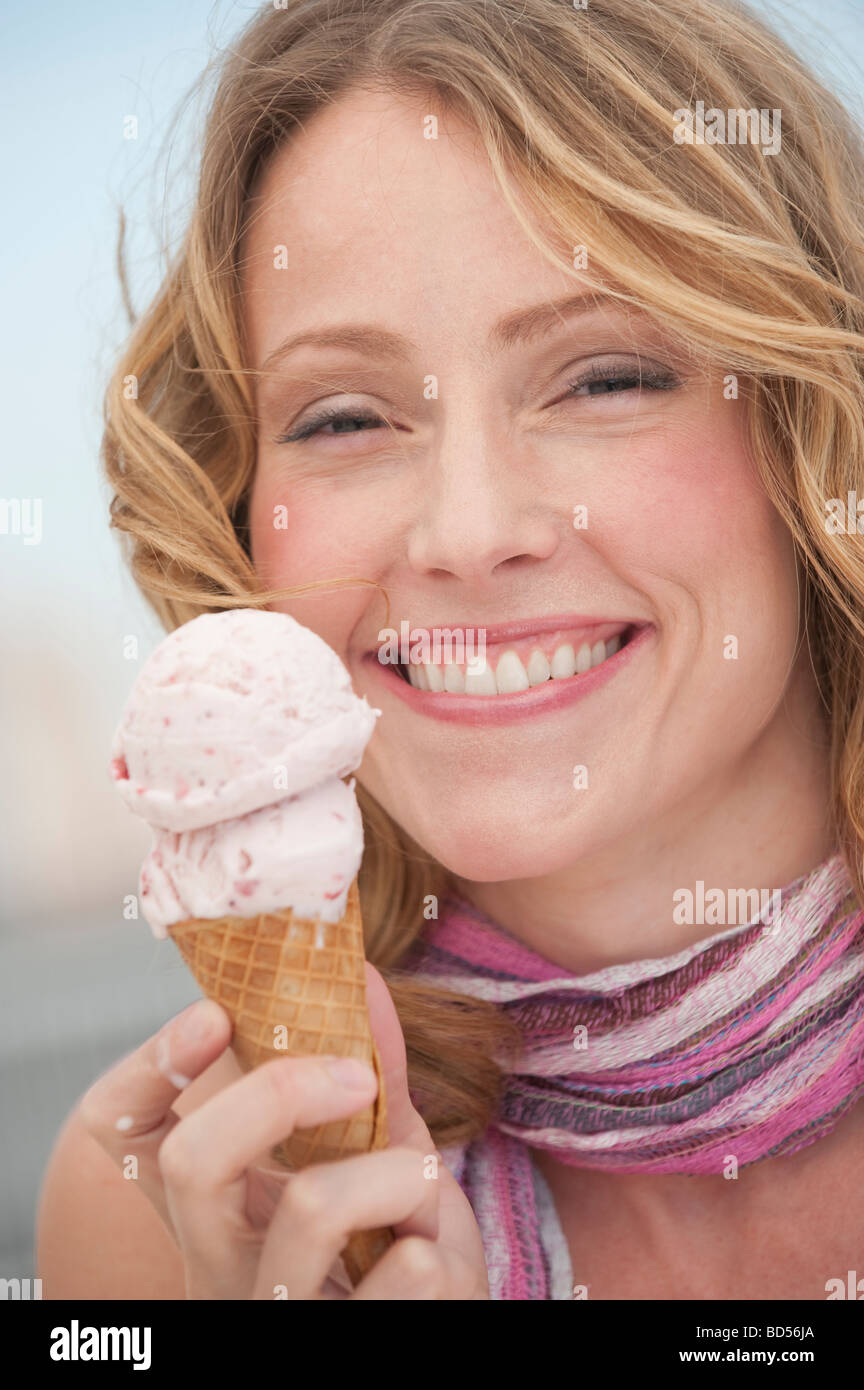 A woman eating ice cream Stock Photo