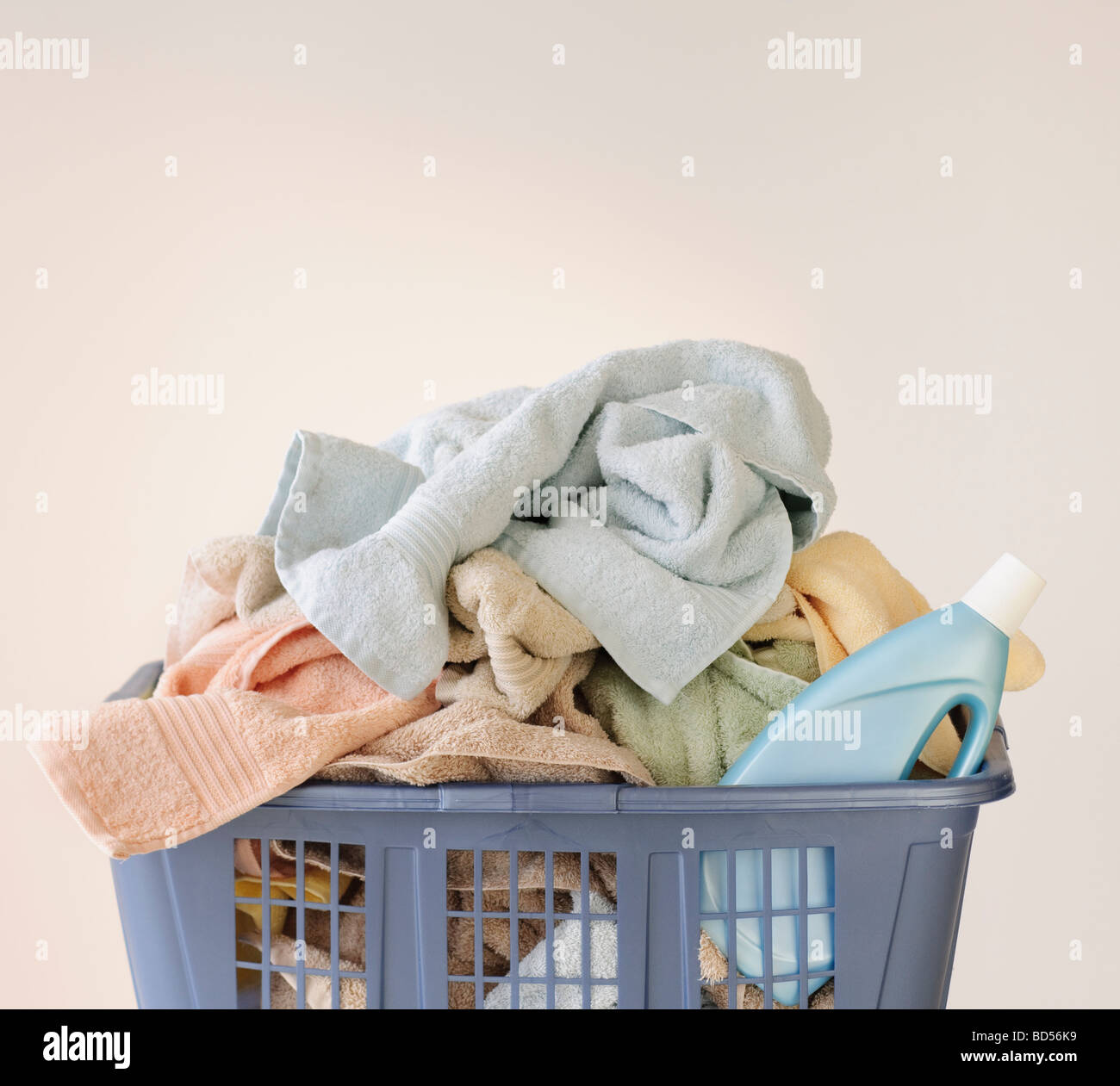 A laundry basket full of towels Stock Photo Alamy