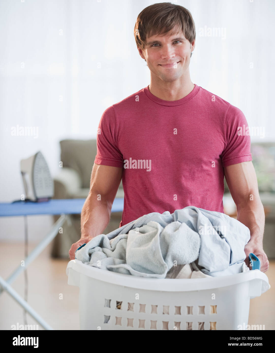 Man doing laundry Stock Photo