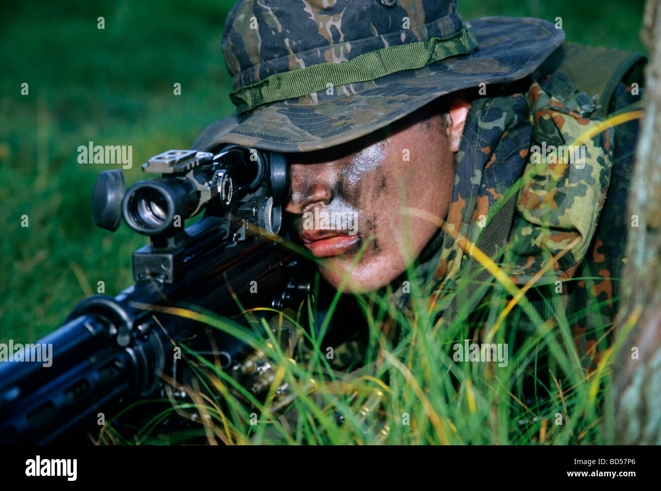 Soldier of the German special forces Kampfschwimmerkompanie in training, sniper with gun G 3 and telescopic sight, camouflage Stock Photo