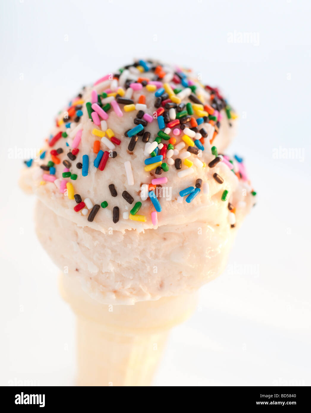 An ice cream cone with sprinkles Stock Photo - Alamy