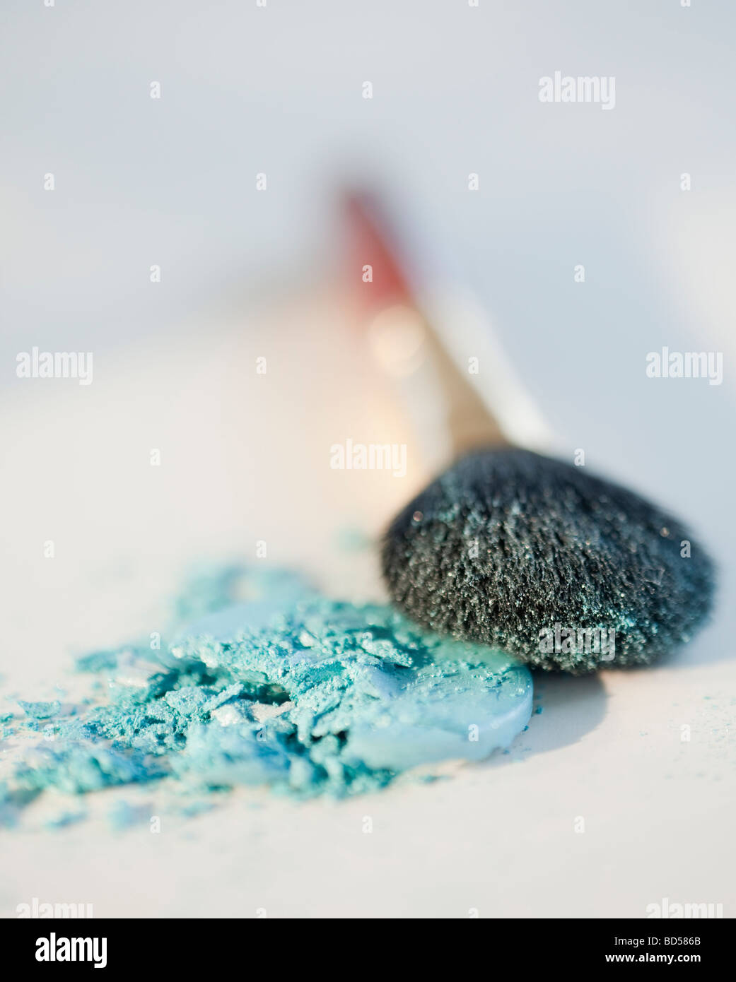 Powder beside a make up brush Stock Photo