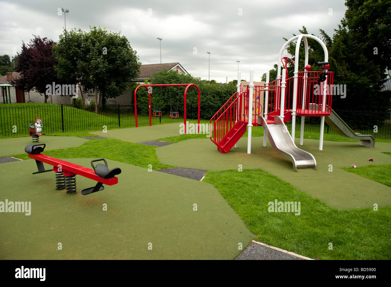 various items of play equipment in a childrens Playground UK Stock Photo