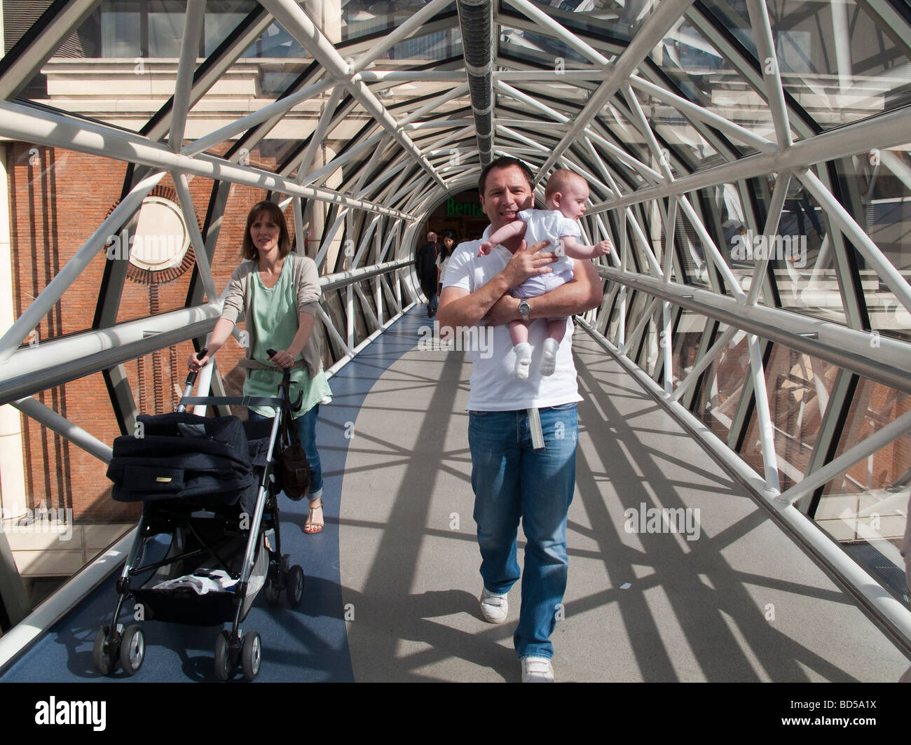 Family in elevated walkway Surrey Stock Photo