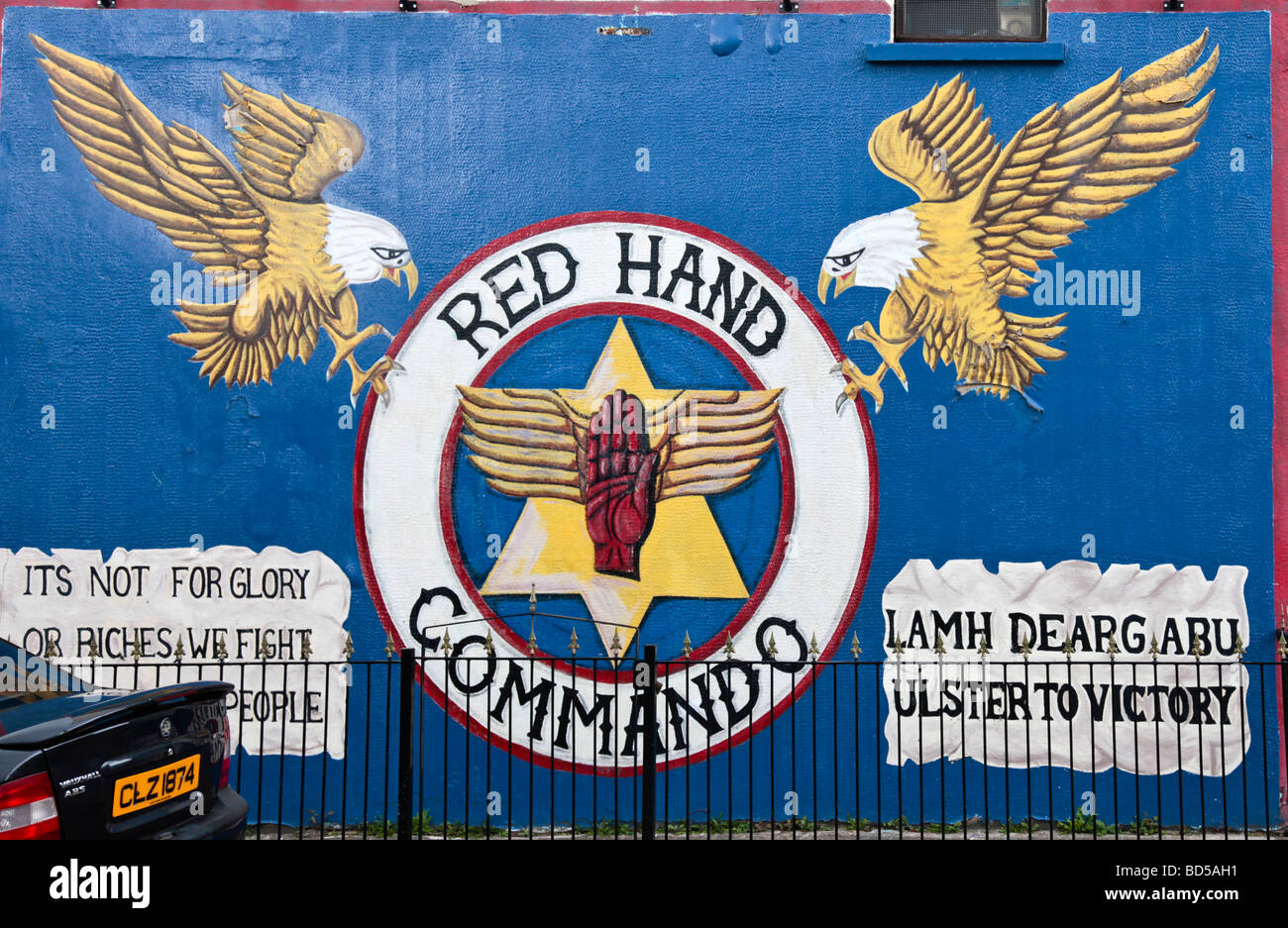 Loyalist mural depicting the Red Hand Commando painted in 2000 in Glenwood Street in the Shankhill area of West Belfast. Stock Photo