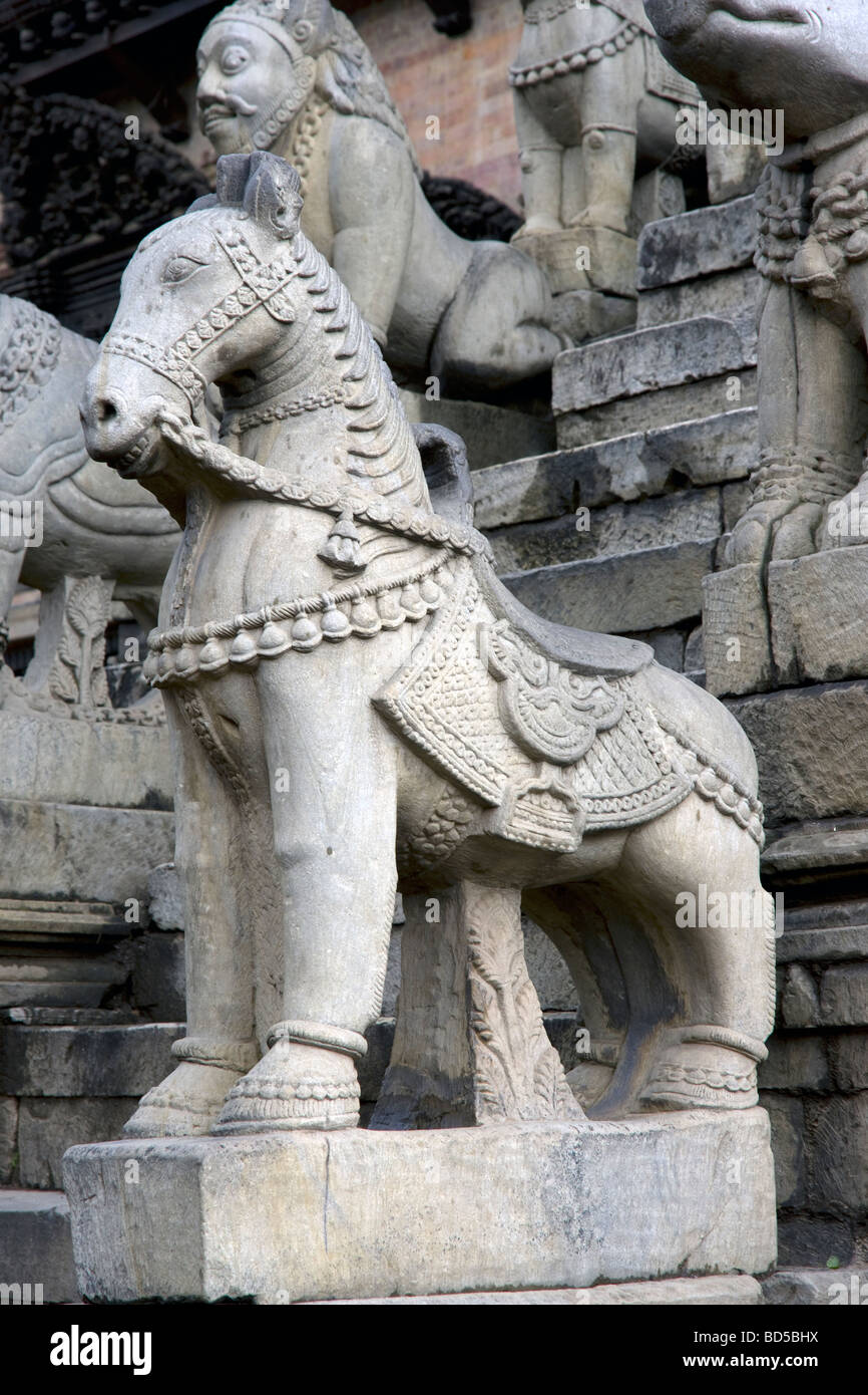carved horse detail on temple base in durbar square Stock Photo