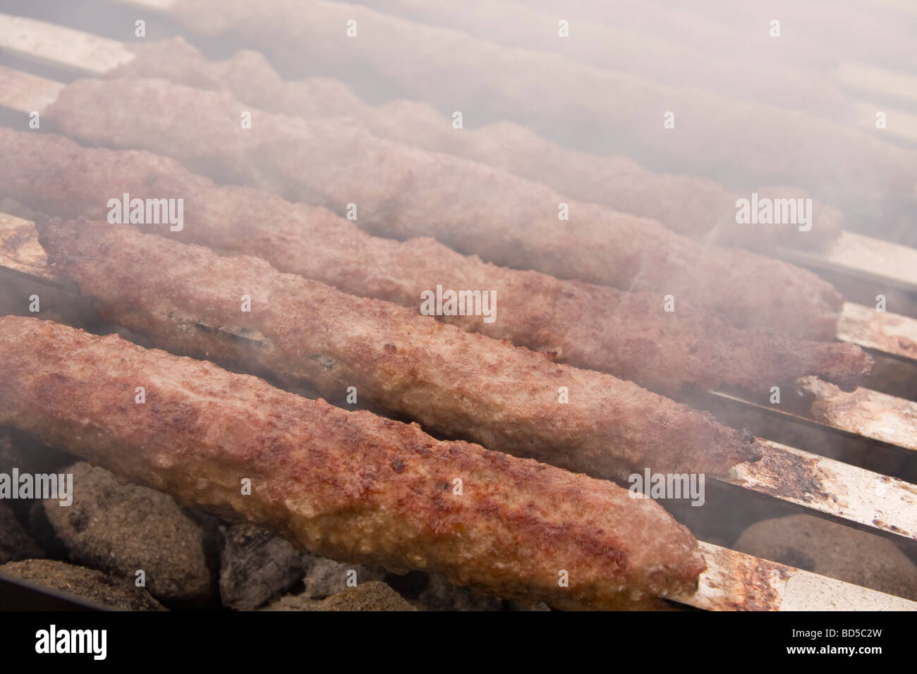 Kebabs cooking on charcoal grill Stock Photo Alamy