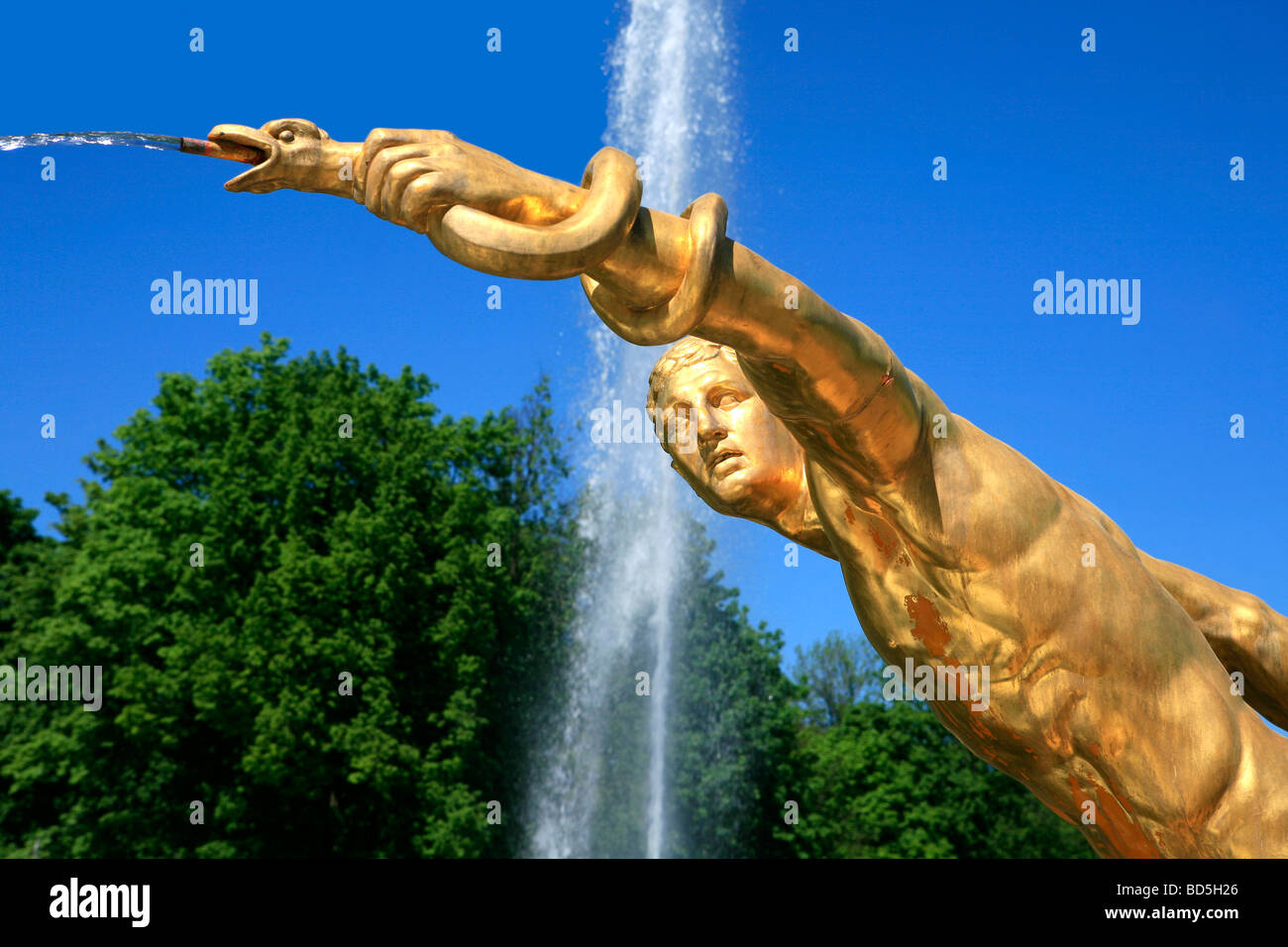 Gilded statue of Apollo holding the snake Python at the Grand Cascade ...
