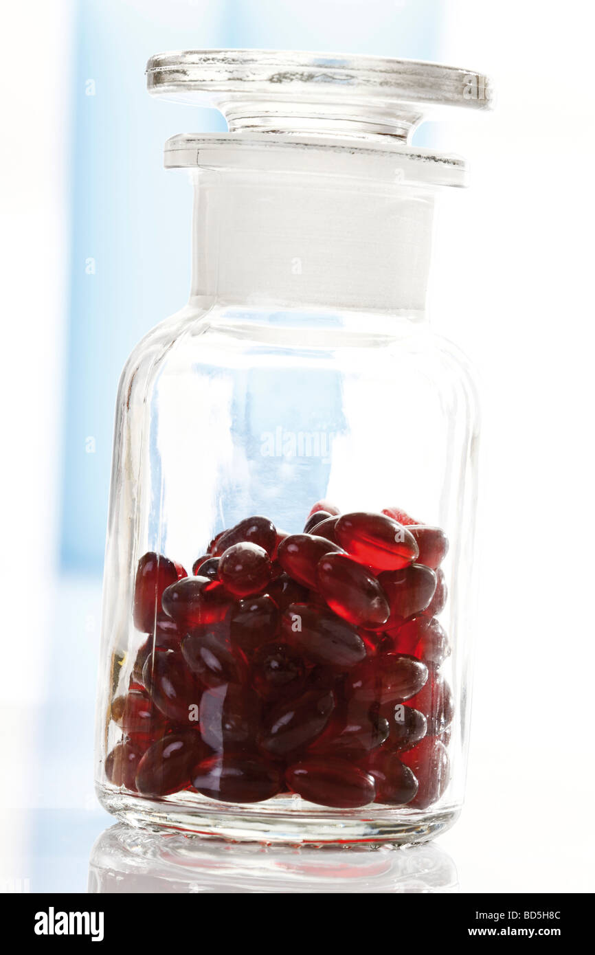 St. John's Wort (Hypericum perforatum) capsules in a pharmacist's bottle Stock Photo
