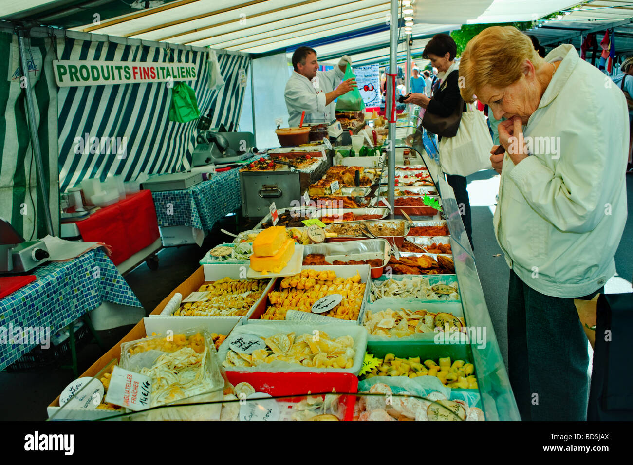 Paris France, Senior Woman Shopping Outside Public Food Markets 'Italian Food' Stall, Display food prices Stock Photo