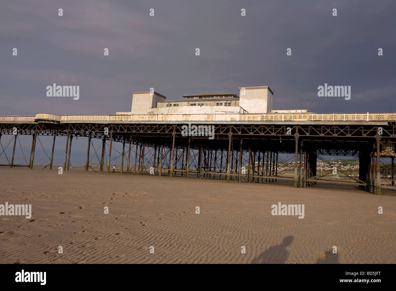 Old decaying Pier on a beach Stock Photo